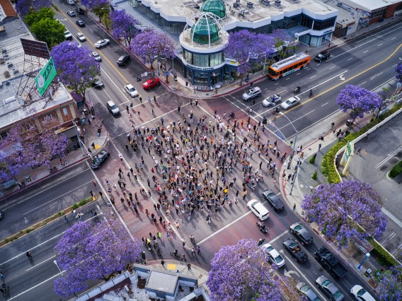 aerial shot of protestors gathering in an intersection