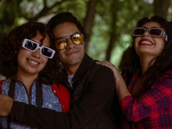 group of people wearing sunglasses and smiling