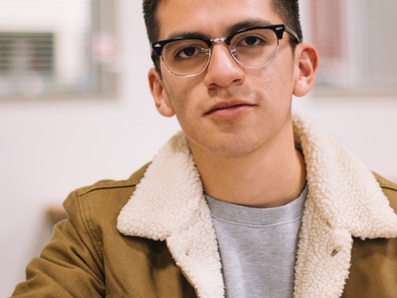man wearing a jacket and glasses