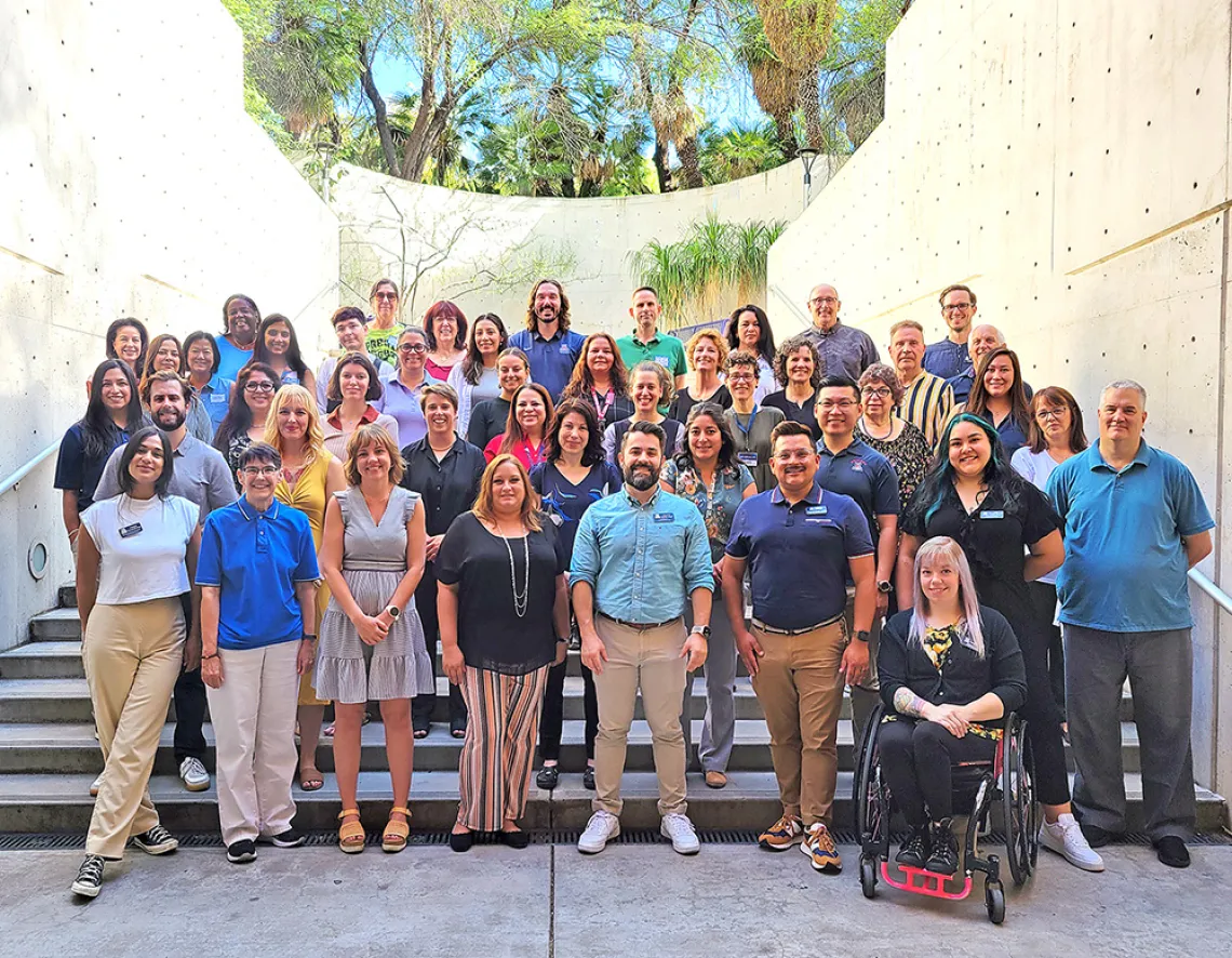 photograph of the CAPS staff standing outdoors