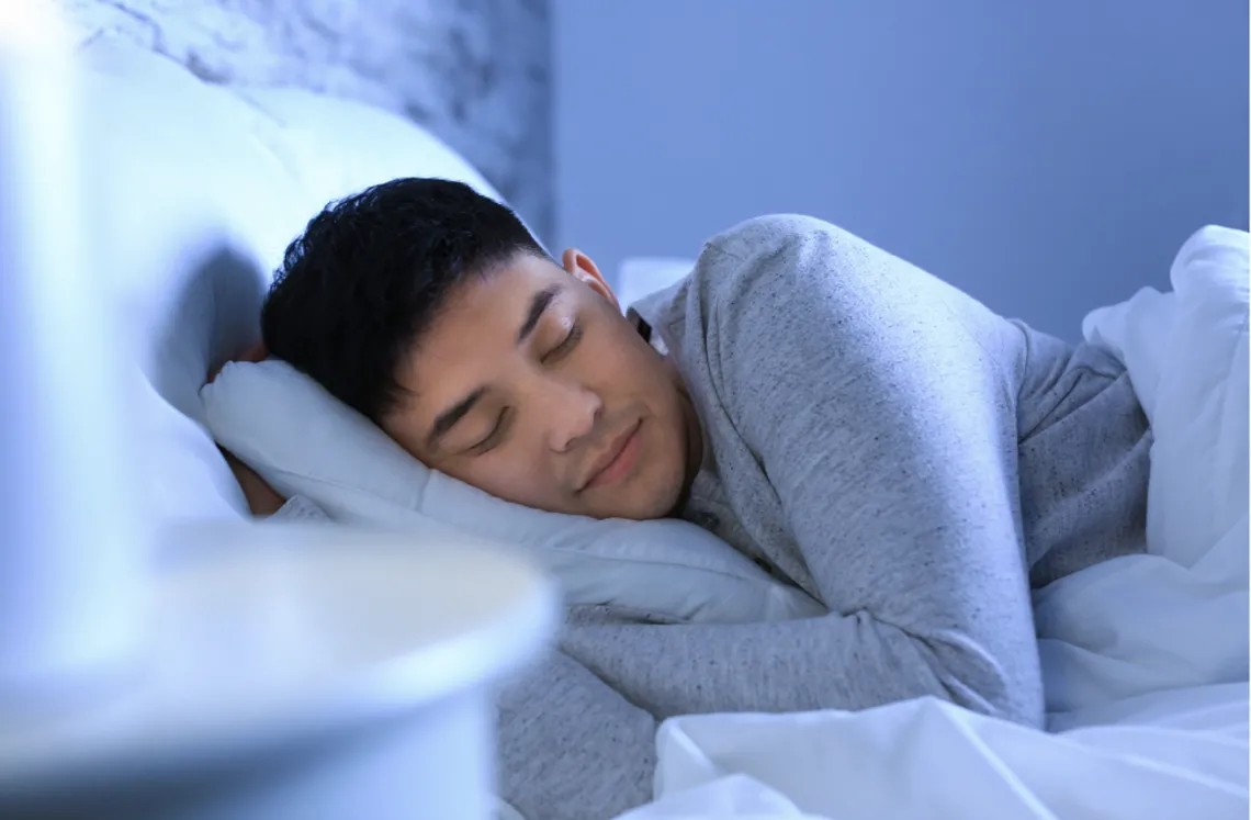 Man sleeping in bed