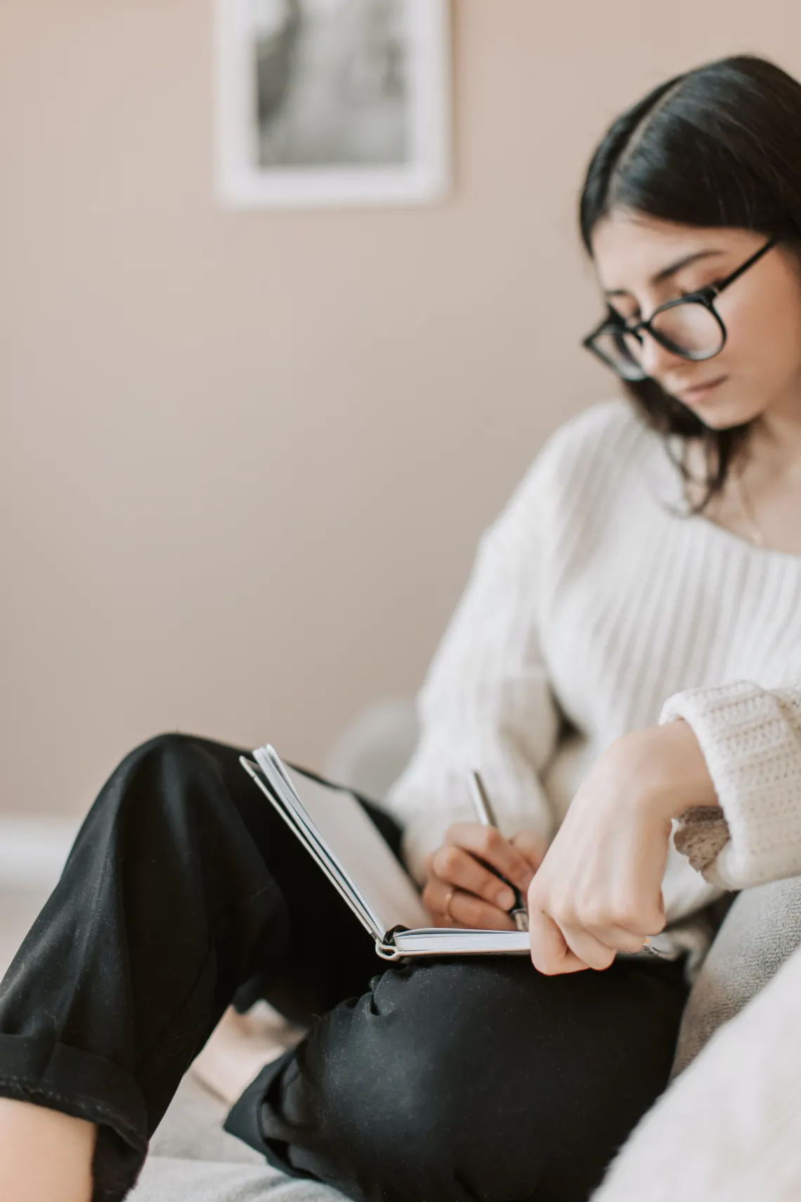 person writing in a journal