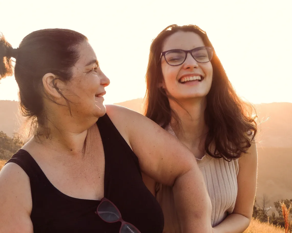 two women walking and laughing